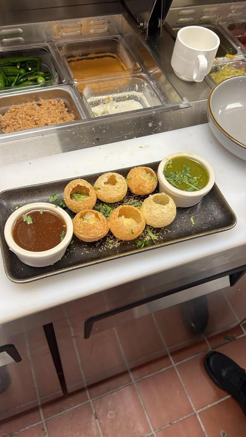 Pani puri with tamarind and mint chutneys